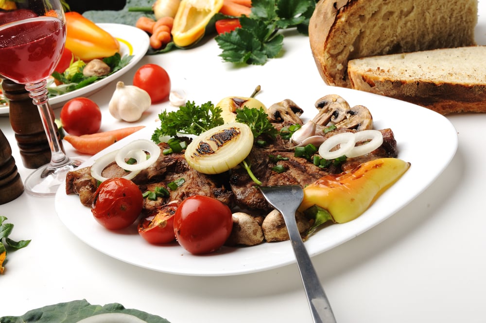 Delicious prepared and decorated food on table in restaurant-1